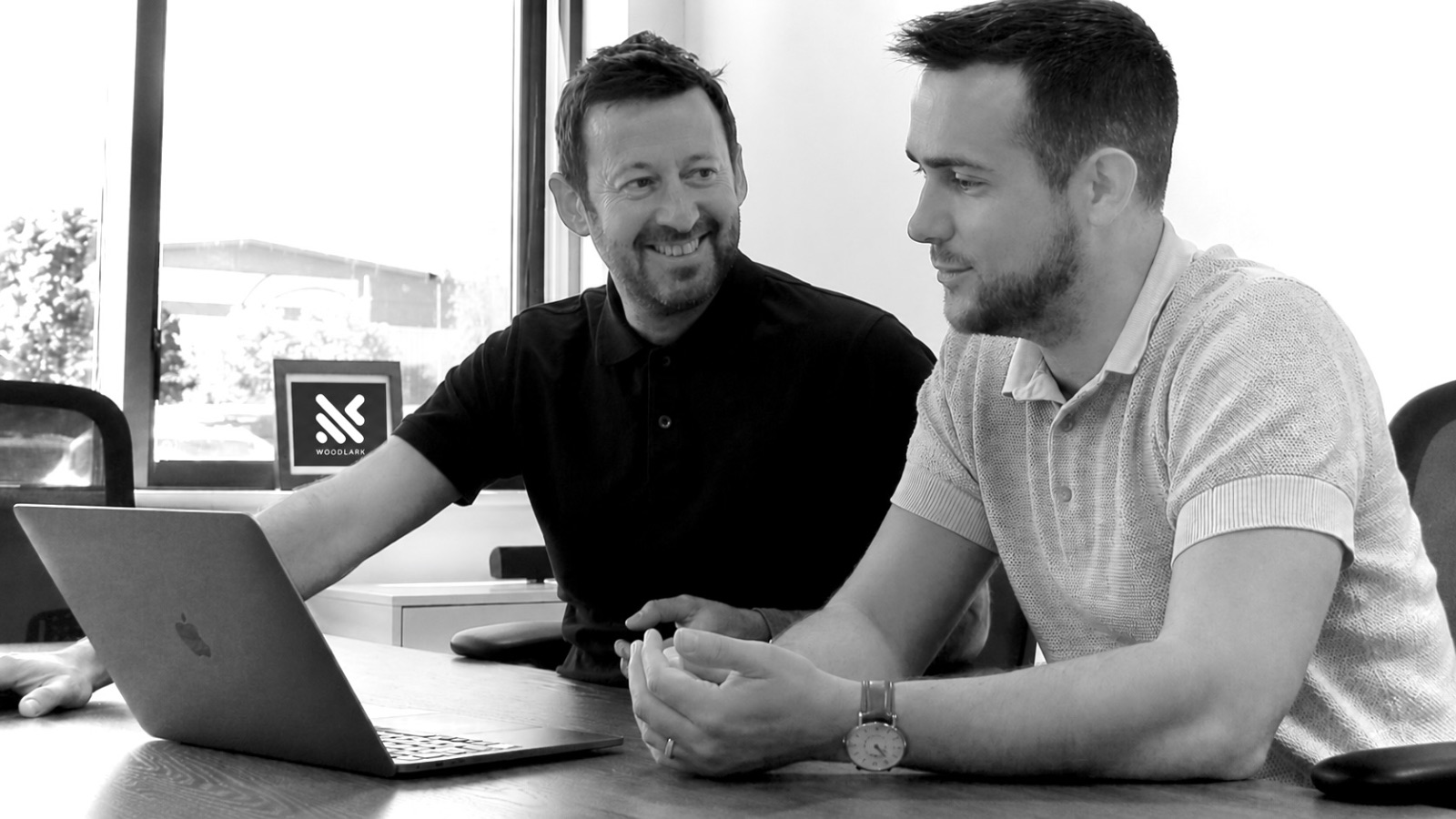 Trent Peek and Richard Ardis working together, natural light